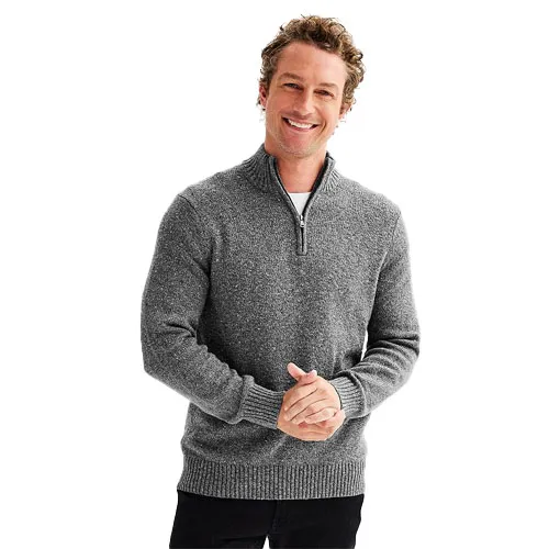 A man wearing a gray half-zip pullover sweater with ribbed cuffs and hem over a white shirt.