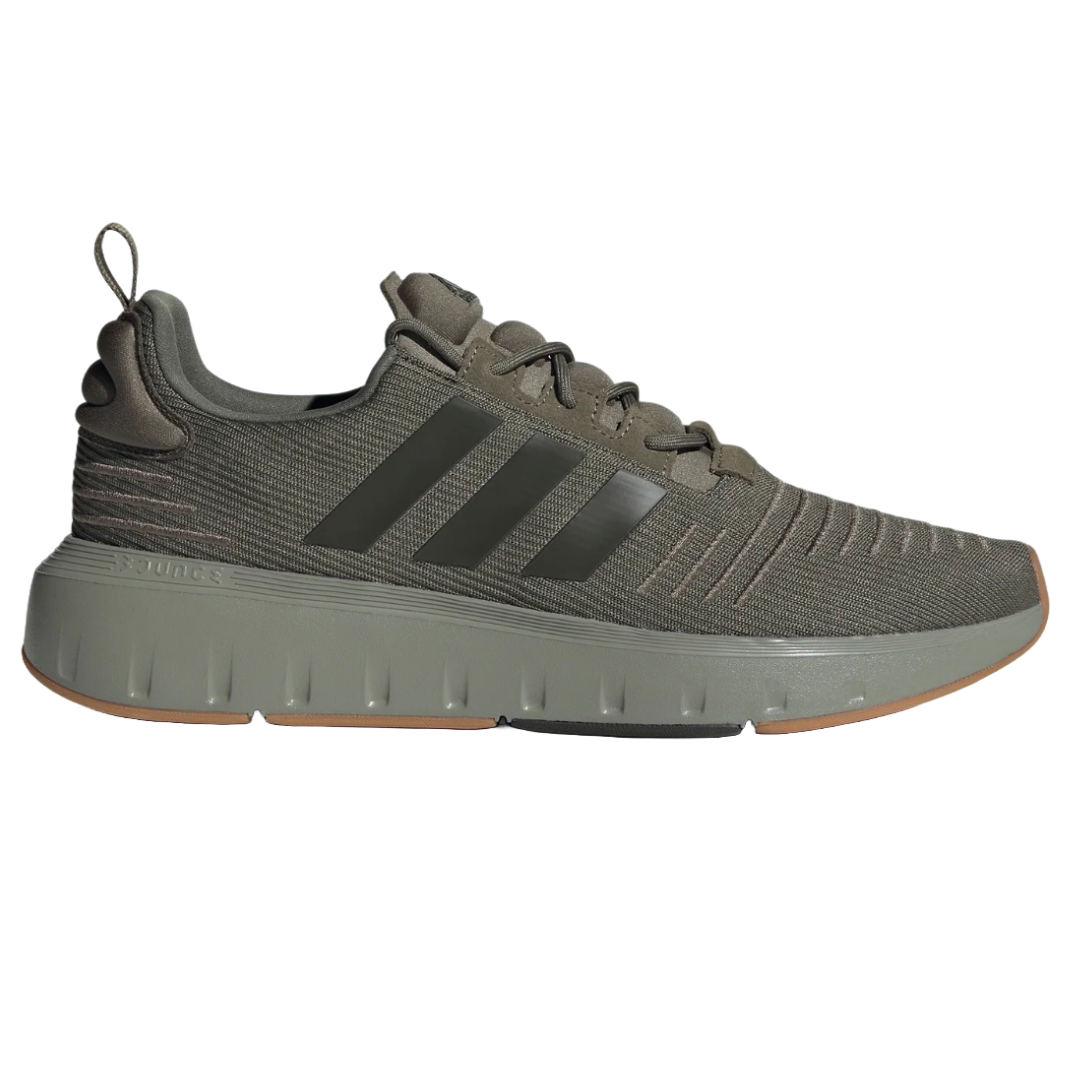Olive green Adidas Men's Swift Run Shoes feature a knitted upper, black three-stripe branding, cushioned midsole for comfort, and a gum rubber outsole for traction.