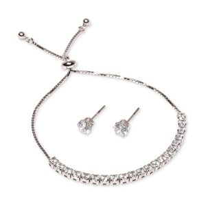 A silver-tone bracelet with sparkling stones and a pair of matching stud earrings, featuring round clear gemstones.