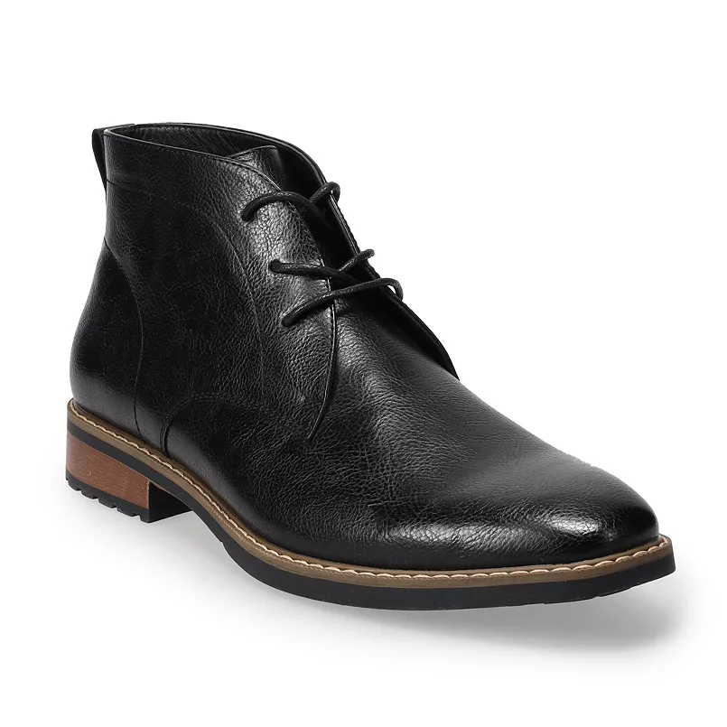 Black leather chukka boots with a sleek design, featuring a lace-up front and a contrast sole with a wooden accent along the heel.