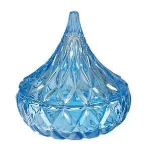 A blue glass decorative jar with a diamond pattern and a teardrop-shaped lid, suitable for various decorative uses.