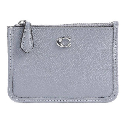 A compact, light grey Coach Mini Skinny ID Case with a pebbled leather texture, featuring a zippered top closure and a small metal \“C\“ logo on the front.