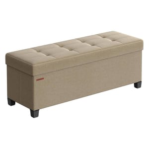 A beige rectangular ottoman with a tufted top and black legs, designed for storage and seating.