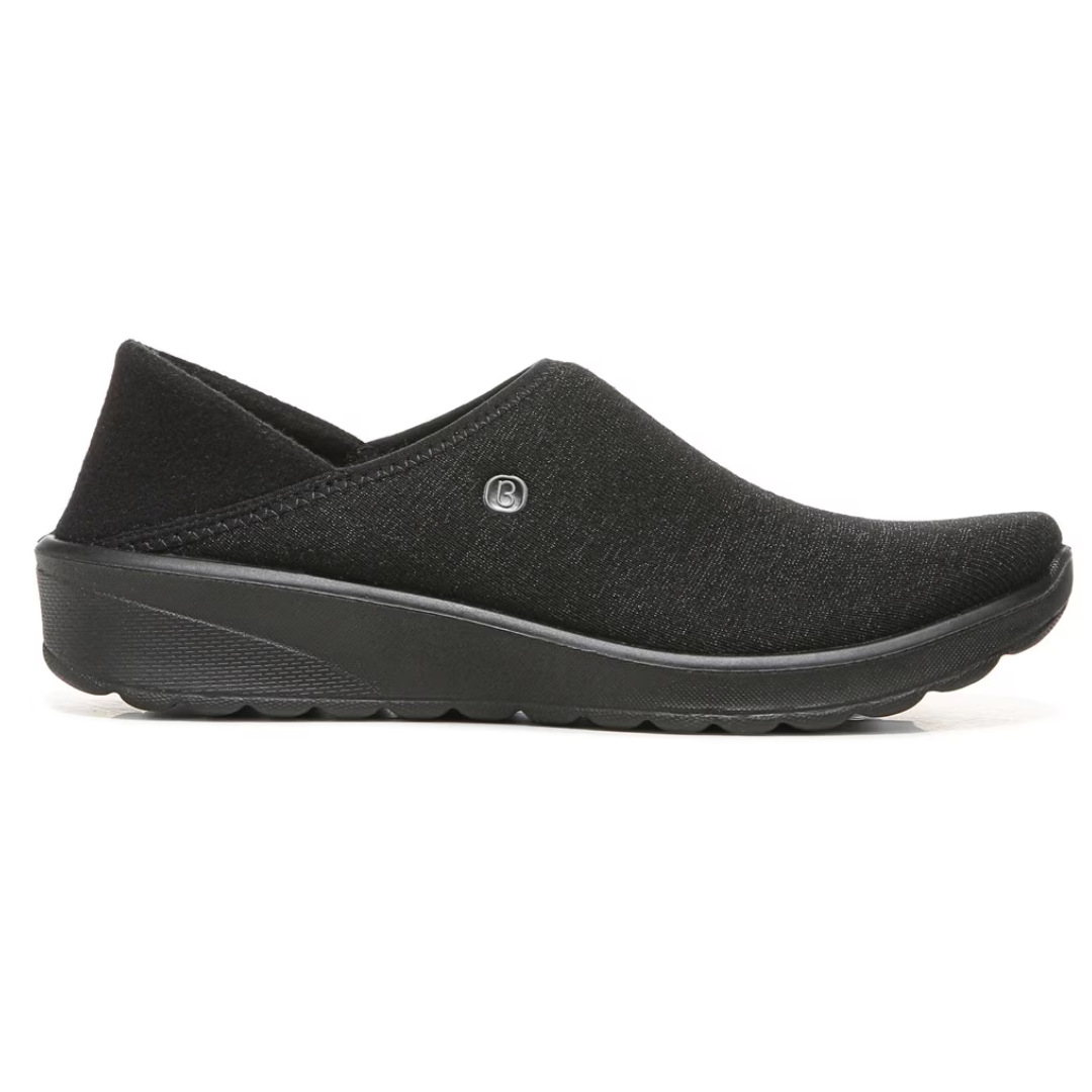 Black slip-on casual shoe with a thick sole and a small logo on the side.