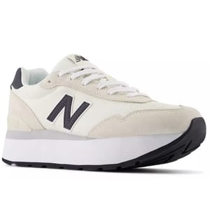 New Balance sneaker featuring a white mesh upper, beige suede accents, and a raised black sole. The shoe displays the iconic 'N' logo on the side.
