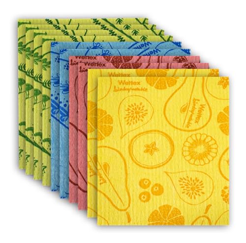 A stack of colorful Swedish dishcloths in various patterns including fruits and botanical designs, in yellow, pink, blue, and green shades.