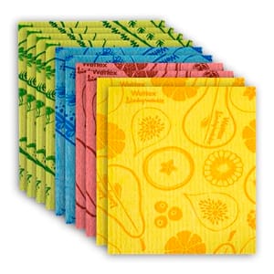 A stack of colorful Swedish dishcloths in various patterns including fruits and botanical designs, in yellow, pink, blue, and green shades.