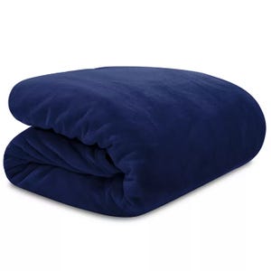 A folded dark blue blanket with a soft, plush texture.