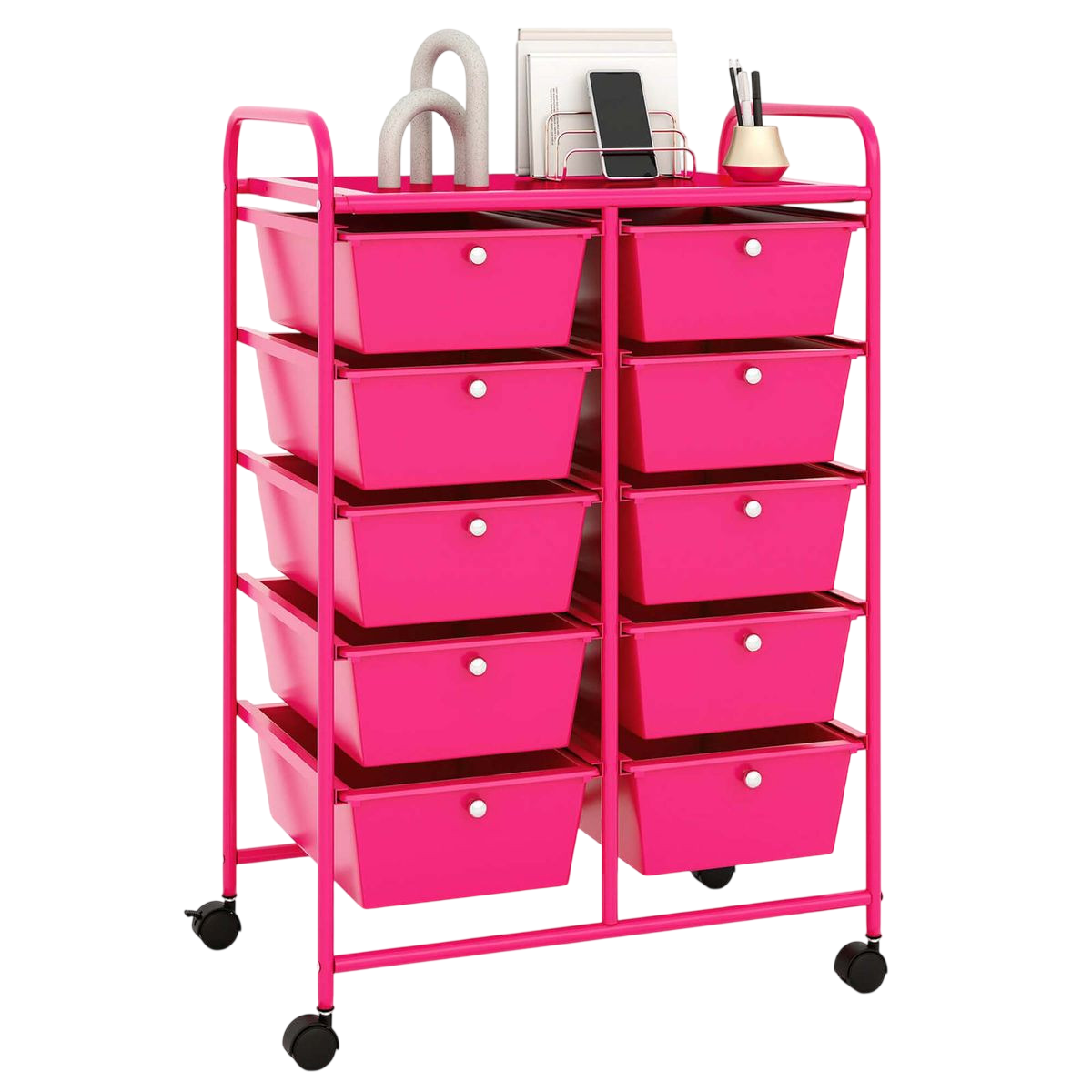 A pink rolling storage cart with 12 drawers, organized in two columns. The top surface holds items like a phone, books, and a pen holder.