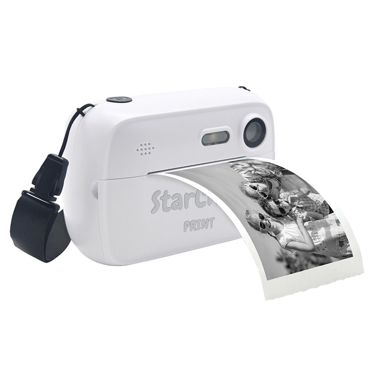 The Lexibook Kid-Cam Printing Camera is a compact, white camera with a built-in printer, featuring a strap for easy carrying. It prints black-and-white photos instantly.