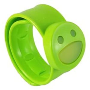 A green silicone slap bracelet with a smiley face design, intended for children, used to repel mosquitoes.