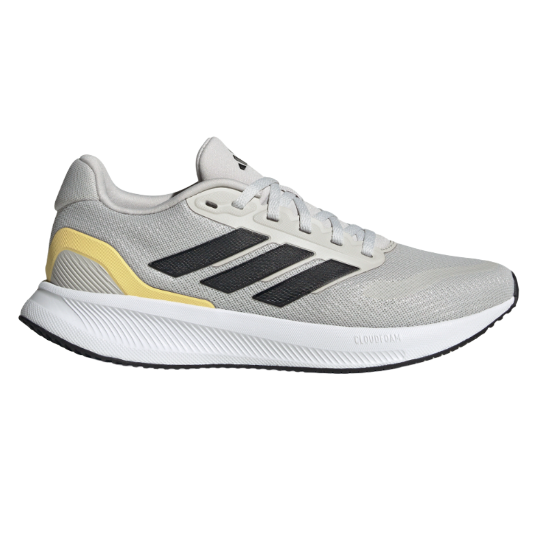 A gray Adidas running shoe featuring a white sole, black stripes, and yellow accents, designed with Cloudfoam cushioning for comfort.