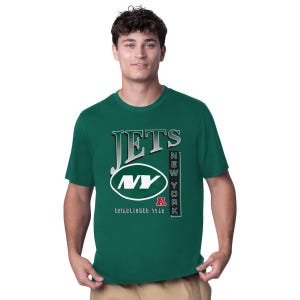 A man is wearing a green short-sleeve T-shirt with the New York Jets NFL team logo and lettering on the front.