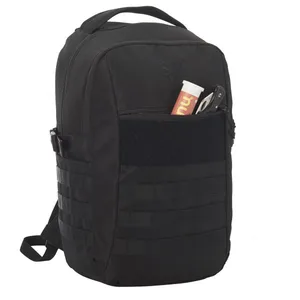 A black tactical backpack with MOLLE webbing features a front pocket containing a small cylindrical container and a folding knife.