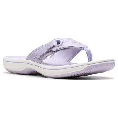 A light purple flip-flop sandal with a cushioned white sole, featuring a toe post design and stitch accents for casual comfort.