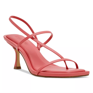 The Steve Madden Locke Heeled Sandals feature thin, asymmetrical straps and a slim heel in a bold coral color. They offer a minimalist and stylish design with an open toe.