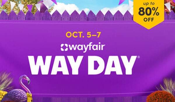 a purple picket fence displaying a purple banner advertising Wayfair's Way Day sale