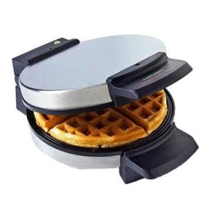 The Black & Decker waffle maker features a round design with stainless steel exterior, nonstick cooking plates, and a deep groove pattern for waffles. It includes cool-touch handles for safety and easy operation.