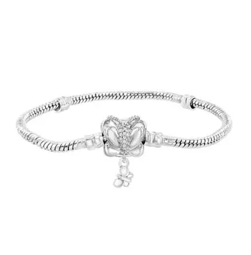 A silver bracelet featuring a butterfly design with a small dangling charm, set on a snake chain.