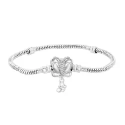 A silver bracelet featuring a butterfly design with a small dangling charm, set on a snake chain.