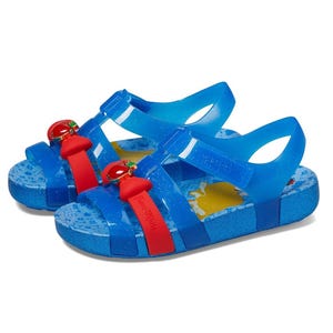 Blue jelly sandals featuring red apple decorations and adjustable straps, with a colorful insole design.