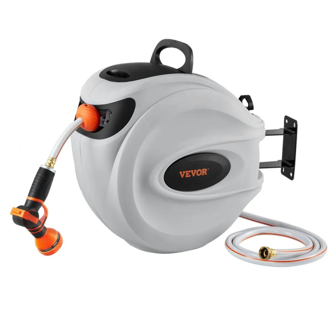 A retractable garden hose reel with a mounted wall bracket and an orange and black spray nozzle. The hose appears to be made of durable material and the reel includes a handle for easy transport.