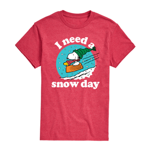 A red T-shirt featuring a cartoon dog sledding with the text \“I need a snow day.\“