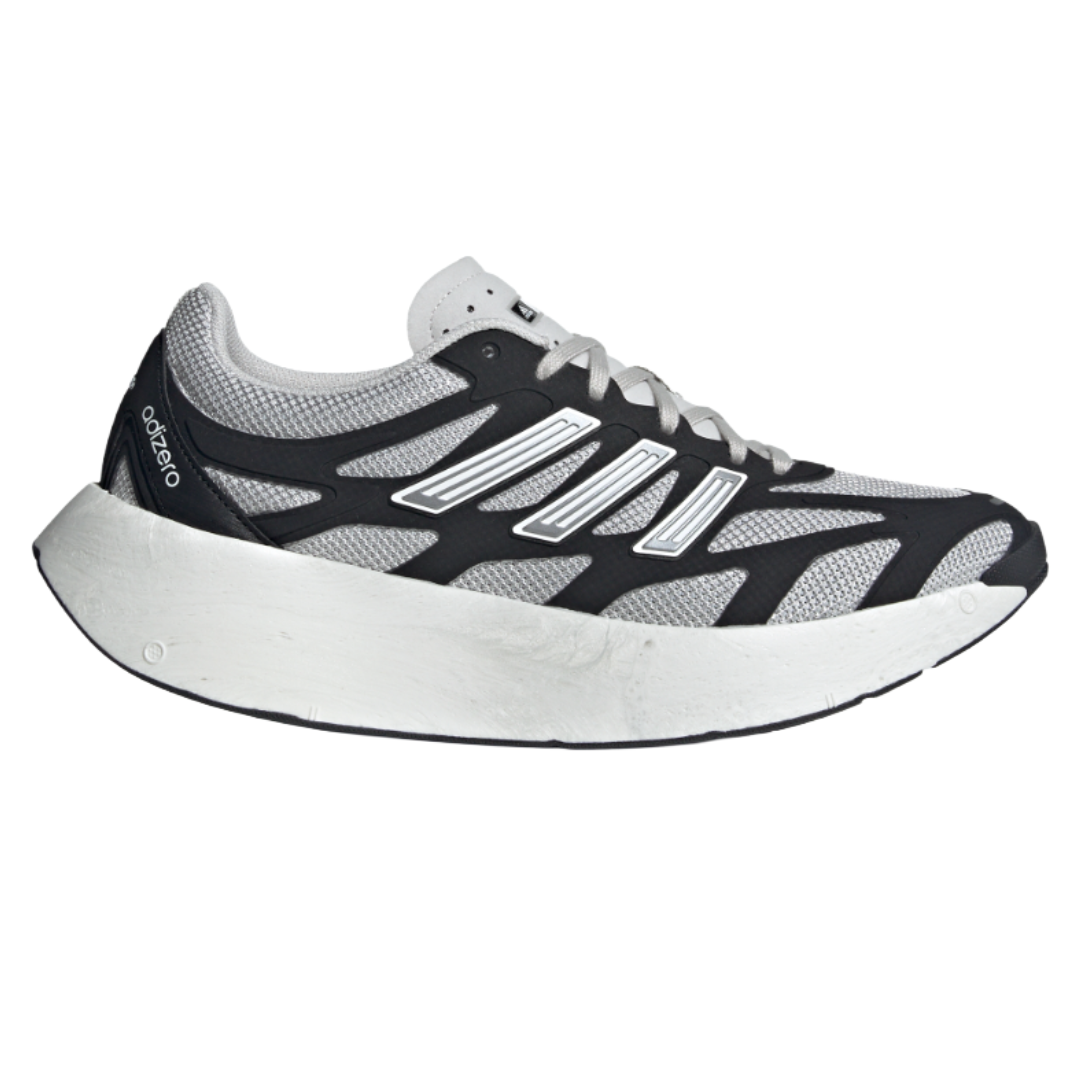 A running shoe with a sleek black and white design, featuring mesh uppers for breathability and a thick white cushioned sole for comfort.