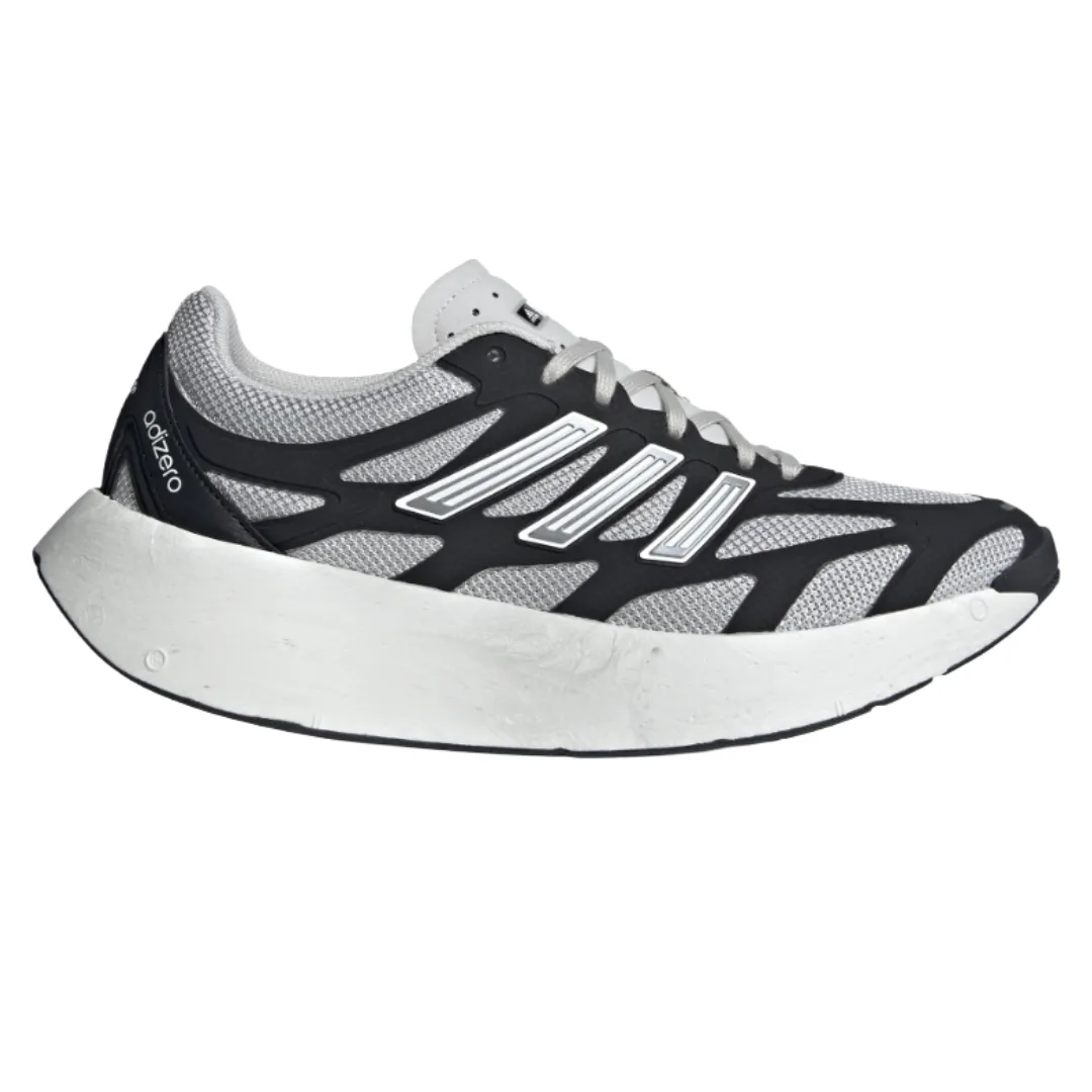 A running shoe with a sleek black and white design, featuring mesh uppers for breathability and a thick white cushioned sole for comfort.