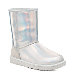 Iridescent silver short boots with a rounded toe, plush lining, and flat sole, featuring a mid-calf height.