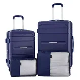 The 4pc French Connection Luggage Set includes two navy blue hardshell suitcases with telescopic handles, accompanied by two packing cubes, one placed in front of each suitcase.