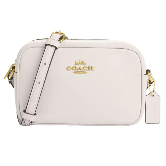 A white Coach crossbody bag featuring gold hardware, a zip closure, and an adjustable strap.