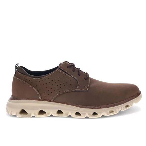 Brown Dockers dress sneakers with perforated sides, a smooth leather finish, and a white cushioned sole featuring unique cutouts for breathability and style.