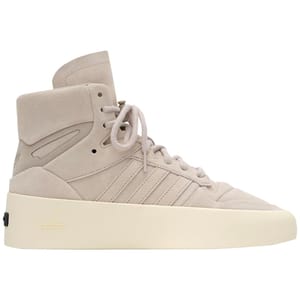 Adidas x Fear of God High Tops feature a beige suede upper with classic Adidas stripes, a high ankle support, and a cream rubber sole. The design includes minimal branding with \“adidas\“ embossed on the sole.