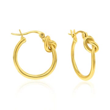 A pair of gold hoop earrings with a knot detail near the clasp.