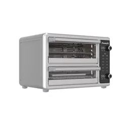 A PowerXL toaster oven with dual cooking compartments, featuring digital controls and adjustable temperature settings.
