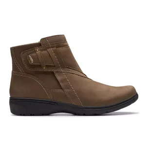Brown ankle-length leather boots with a side strap detail and stitching accents, featuring a black rubber sole for comfort and durability.