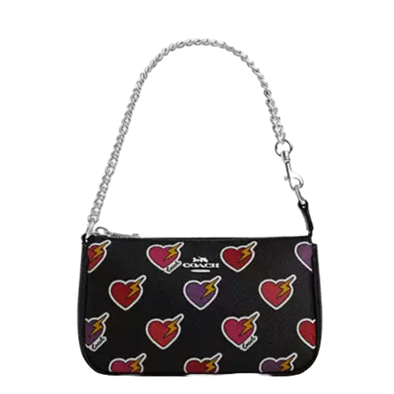 Coach Outlet Nolita Heart Bolt features a black design with colorful heart and lightning bolt motifs, a silver-tone chain strap, and a small Coach logo in the center.