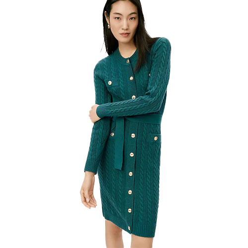 A woman models a teal cable-knit cardigan dress with gold button accents and a waist tie.
