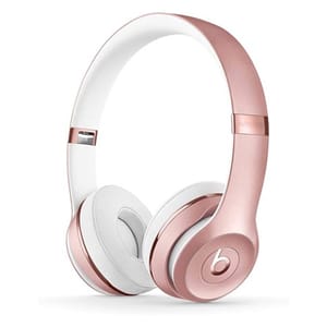 Rose gold and white wireless headphones with an over-ear design and a prominent logo on the side.