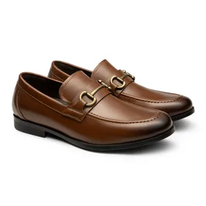 Brown leather loafers with gold horsebit detailing, featuring a low heel and moccasin-style stitching.