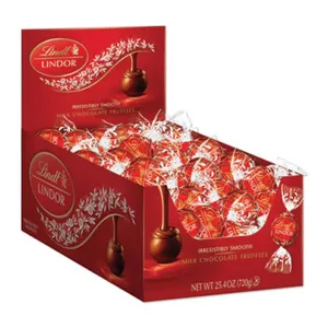A display box of Lindt Lindor milk chocolate truffles, featuring individually wrapped red and white foil chocolates with the label \“irresistibly smooth.\“ Net weight: 25.4 oz (720g).