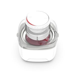 A Cuisinart ice cream maker with a clear lid is shown. The machine is white with a round top and has red-colored ice cream in the processing bowl.