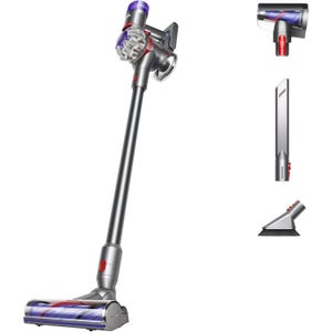 Cordless stick vacuum cleaner with three attachments: motorized cleaner head, crevice tool, and combination brush tool.