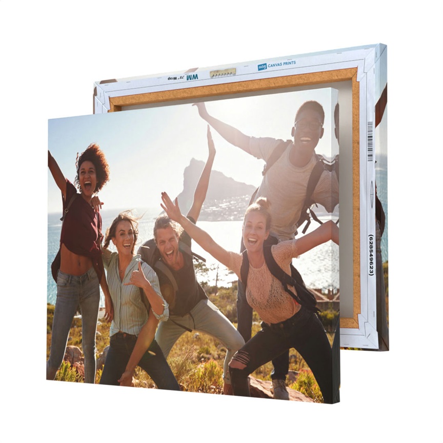 Two canvas prints featuring a group of people joyfully posing outdoors, with one canvas slightly behind the other.