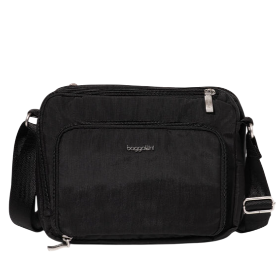A black crossbody bag with silver zippers and the \“Baggallini\“ logo on the front. It features an adjustable shoulder strap and a front zip pocket.
