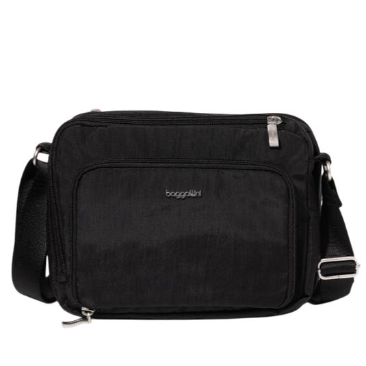 A black crossbody bag with silver zippers and the \“Baggallini\“ logo on the front. It features an adjustable shoulder strap and a front zip pocket.