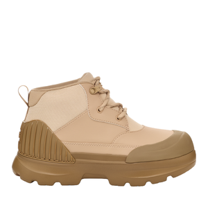 The UGG Neumel X Waterproof Boot is a beige mid-height boot with a rugged sole, reinforced heel, and waterproof features. It has a pull tab at the back and lace-up closure for a secure fit, designed for durability and comfort in wet conditions.