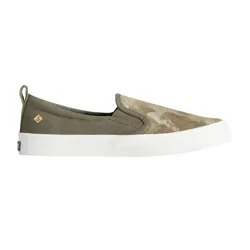 A camouflage slip-on shoe with a white rubber sole, featuring a small logo tag on the side and a pull tab at the heel.