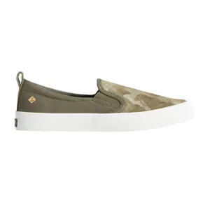 A camouflage slip-on shoe with a white rubber sole, featuring a small logo tag on the side and a pull tab at the heel.